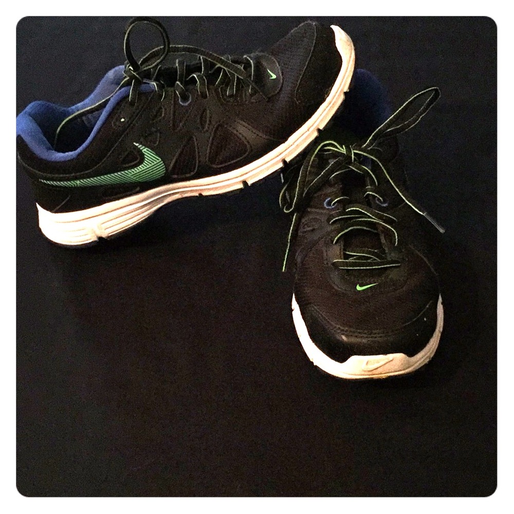 Black, neon green, and blue Nike’s